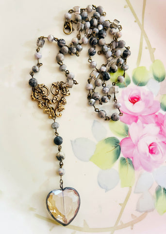 Necklace with a heart-shaped pendant on a floral background