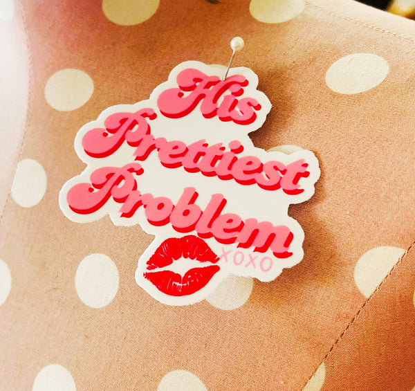 Sticker with 'His Prettiest Problem' text on a polka dot background