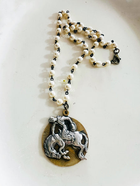 Necklace with a horse pendant on a white background
