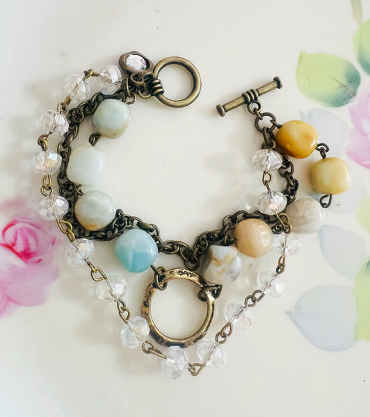 Bracelet with multicolored beads and floral background